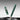 A green translucent pen with gold-tone accents shown with its cap removed, floating above a dark reflective surface against a gray gradient background.